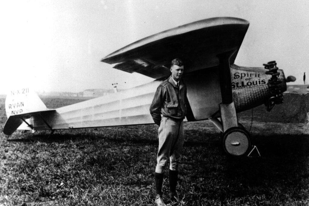 FILE (AP) --WITH THE SPIRIT OF ST. LOUIS-- Charles A. Lindbergh is shown in this 1927 file photo with his plane, the Spirit of St. Louis, with which he made the first solo crossing of the atlantic from west to east, the same year. (AP-Photo/-1927-)