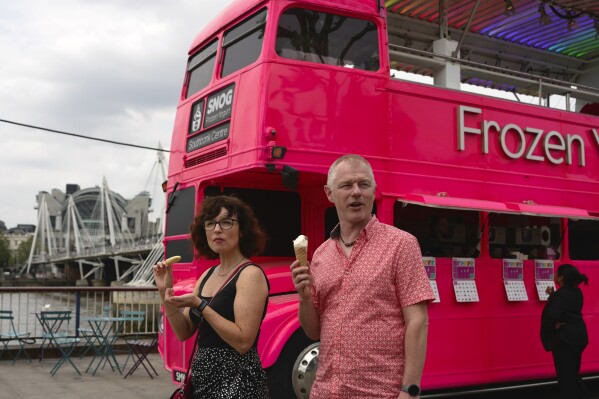 FILE - People have ice-cream during a hot weather day in the Central London, June 12, 2023. The National Oceanic and Atmospheric Administration said Thursday, July 13, an already warming Earth steamed to its hottest June on record. (AP Photo/Kin Cheung, File)