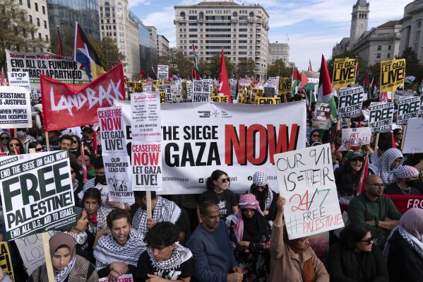 Anti-war activists rally during a pro-Palestinian demonstration asking to cease fire in Gaza, at Freedom Plaza in Washington, Saturday, Nov. 4, 2023. (AP Photo/Jose Luis Magana)