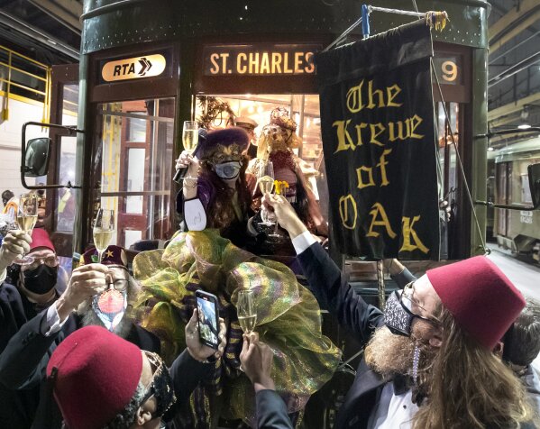 Peggy Scott Laborde and members of the Krewe of Oak toast Carnival as the Phunny Phorty Phellows start their 40th anniversary streetcar ride ushering in Carnival at the Willow Street car barn in Ne...