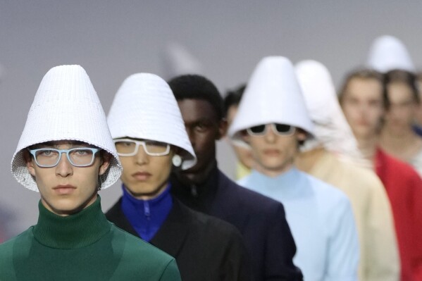 Models wear creations as part of the men's Prada Spring-Summer 2026 collection, that was presented in Milan, Italy, Sunday, June 22, 2025. (AP Photo/Luca Bruno)