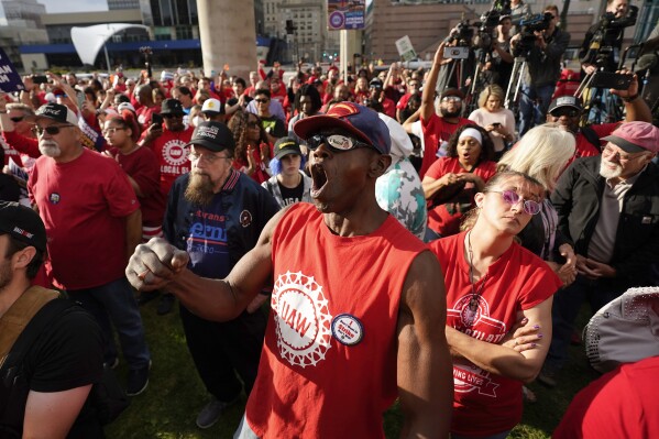 United Auto Workers member Michael Metcalf cheers during a rally in Detroit, Friday, Sept. 15, 2023. The UAW is conducting a strike against Ford, Stellantis and General Motors. (AP Photo/Paul Sancya)