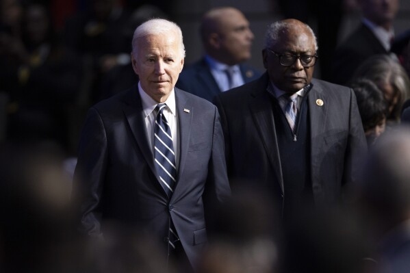 President Joe Biden walks with Rep. Jim Clyburn, D-S.C., during U.S. Rep. Eddie Bernice Johnson's wake at Concord Church in Dallas on Monday, Jan. 8, 2024. Johnson, a trailblazing North Texas Democrat who served 15 terms in Congress, died on Dec. 31. (Juan Figueroa/The Dallas Morning News via AP, Pool)