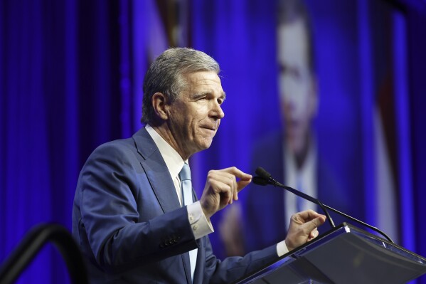 FILE - N.C. Gov. Roy Cooper speaks at the North Carolina Democratic Unity Dinner fundraiser in Raleigh, N.C., Saturday, July 20, 2024. (AP Photo/Karl B DeBlaker, File)