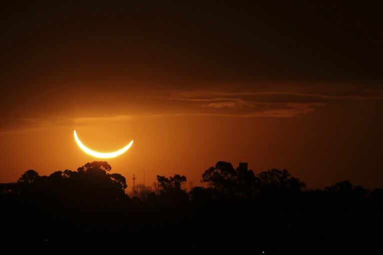 FILE - The moon passes in front of the setting sun during a total solar eclipse in Buenos Aires, Argentina, Tuesday, July 2, 2019. (AP Photo/Marcos Brindicci, File)