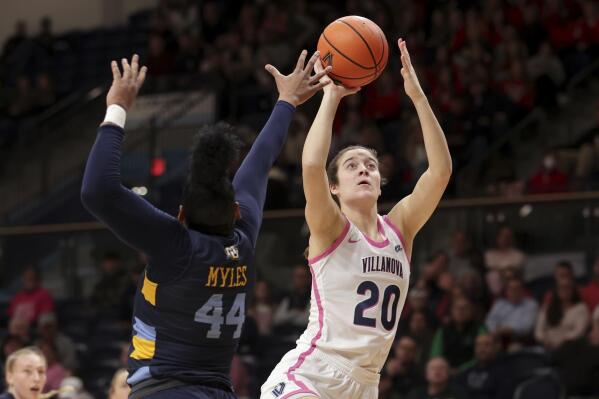 Villanova's Maddy Siegrist (20) shoots over Marquette's Kennedi Myles of Marquette during the first half of an NCAA college basketball game, Wednesday, Feb. 1, 2023, in Villanova, Pa. (Charles Fox/The Philadelphia Inquirer via AP)