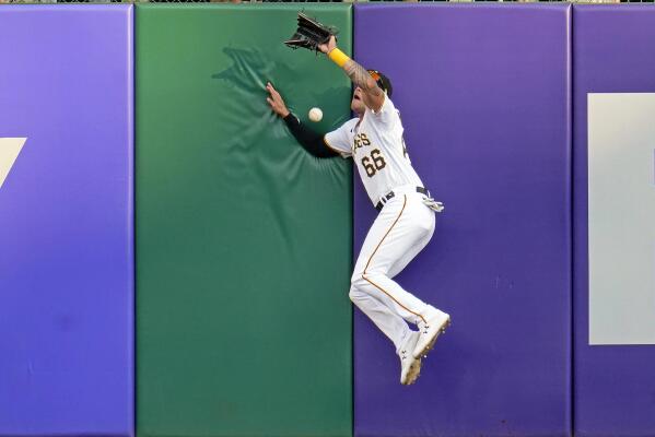 Pittsburgh Pirates' Cal Mitchell, right, celebrates with Bligh