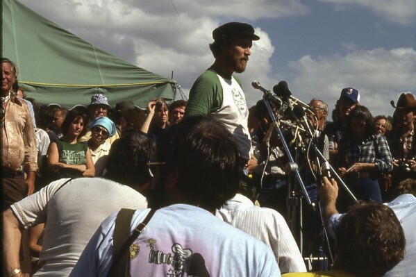 In this 1979 photograph, Jim Williams speaks during a protest against the damming of the Little Tennessee River, home or the Snail Darter, in Tenn. The fish was at the center of a battle between developers of the Tellico Dam and conservationists. (Courtesy of C. Kenneth Dodd Jr. via AP)