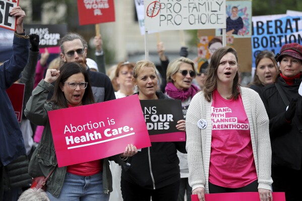 FILE - Supporters of Issue 1, the Right to Reproductive Freedom amendment, attend a rally held by Ohioans United for Reproductive Rights at the Ohio Statehouse in Columbus, Ohio, Oct. 8, 2023. As campaigning escalates in Ohio's fall fight over abortion rights, a new line of attack from opponents suggests "partial-birth" abortions would be revived if a proposed constitutional amendment passes. (AP Photo/Joe Maiorana, File)