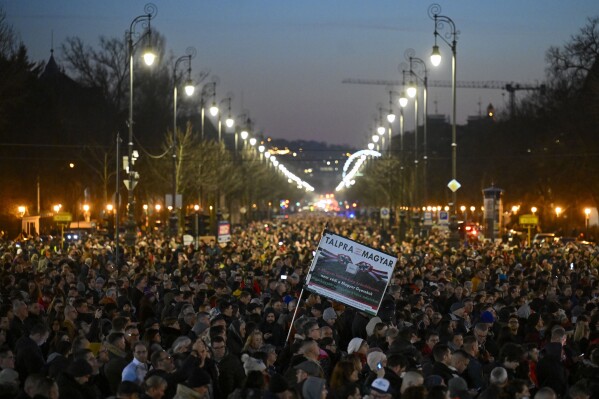 People gather during a protest at Heroes' Square in Budapest, Hungary, Friday, Feb 16, 2024. Protesters demand a change in the country's political culture after the conservative head of state resigned amid scandal over a presidential pardon. (AP Photo/Denes Erdos)