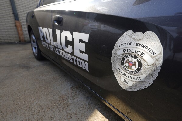 FILE - A Lexington, Miss., police cruiser is parked outside their facility near the town square, Monday, Aug. 15, 2022. The Lexington police department unconstitutionally jailed people for unpaid fines without first assessing whether they could afford to pay them, the U.S. Department of Justice said Thursday, Feb. 29, 2024. (AP Photo/Rogelio V. Solis, File)