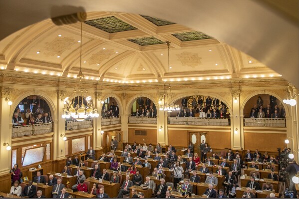 FILE - In this Jan. 8, 2019 photo, South Dakota state legislators listen while Gov. Kristi Noem delivers the State of the State address at the state Capitol in Pierre, S.D. (Ryan Hermens/Rapid City Journal via AP, File)