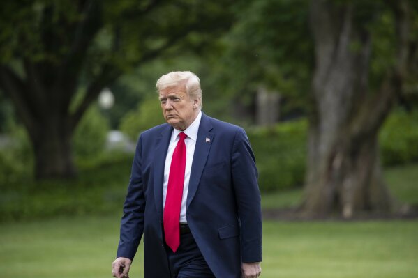 President Donald Trump walks across the South Lawn of the White House in Washington, Sunday, May 17, 2020. Trump was returning from nearby Camp David, Md. (AP Photo/Alex Brandon)