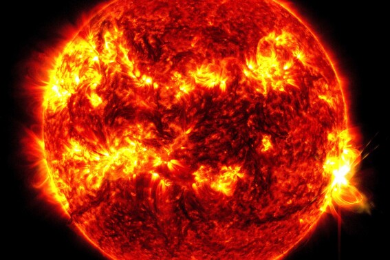 This image provided by NASA's Solar Dynamics Observatory shows a solar flare, the bright flash at right, on Tuesday, May 14, 2024. The sun produced its biggest flare in nearly a decade Tuesday, just days after a severe solar storm pummeled Earth and created dazzling northern lights in unaccustomed places. (NASA/SDO via AP)