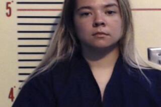 This undated booking photo provided by Parker County, Texas, sheriff's office shows Cynthia Marie Randolph.  Randolph  told investigators that she left her 2-year-old daughter and 16-month-old son in a hot car where they died   May 26 , 2017,  to teach the girl a lesson, and that they didn't lock themselves in, as she initially said, according to sheriff’s officials.   Randolph was being held Saturday, June 24, 2017 on two counts of causing serious bodily injury to a child.   (Parker County, Texas, sheriff's office via AP)