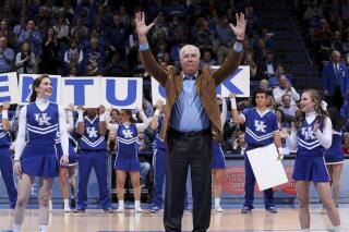 This photo provided by University of Kentucky Athletics shows Mike Pratt gesturing to fans after Kentucky beat Georgia in an NCAA college basketball game at Rupp Arena in Lexington, Ky., Dec. 31, 2017. Kentucky Athletics Hall of Famer Mike Pratt, who helped lead the Wildcats to three SEC championships and two Elite Eight appearances, has died. He was 73. Pratt, a UK Sports Network men’s basketball radio color analyst since 2001, died Thursday, June 16, 2022, a statement from the school said. (Elliott Hess/UK Athletics via AP)