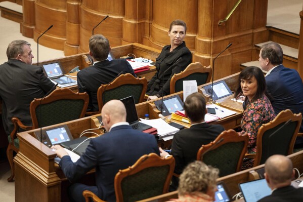 Front row, from left Denmark's Foreign Minister Lars Loekke Rasmussen, Defence Minister Troels Lund Poulsen and Prime Minister Mette Frederiksen are seated at Folketinget, during a parliamentary vote, in Copenhagen, Denmark, Thursday Dec. 7, 2023. A new law has been passed in Denmark’s parliament that makes it illegal to desecrate any holy text in the country. The vote on Thursday came after a recent string of public desecrations of the Quran by a handful of anti-Islam activists sparked angry demonstrations in Muslim countries. (Mads Claus Rasmussen/Ritzau Scanpix via AP)