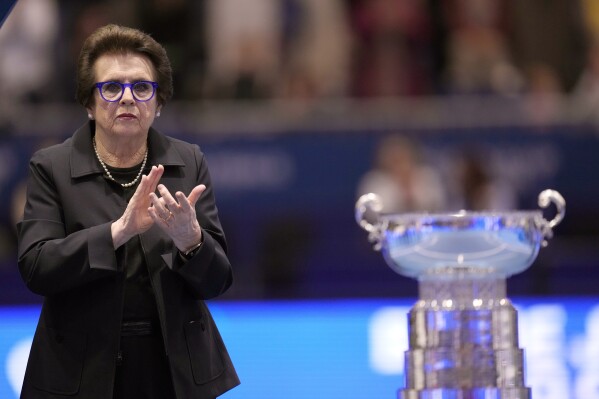 FILE - Billie Jean King applauds next to Canada's Leylah Fernandez, who won the final singles tennis match against Italy's Jasmine Paolini, during the Billie Jean King Cup finals in La Cartuja stadium in Seville, southern Spain, Sunday, Nov. 12, 2023. The ATP, which runs men’s professional tennis, has a five-year deal to hold one of its biggest events in the Saudi port city of Jeddah. Talks between the Saudis and the women’s tour are reportedly ongoing. In a sign of how the conversation has shifted, King, who began the fight for equal pay for women in sports in the 1970s, has said bringing the sport to the kingdom might not be all bad despite its long record of repressing women's rights. (AP Photo/Manu Fernandez, File)