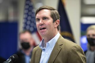 FILE - Democratic Kentucky Gov. Andy Beshear speaks while touring the FEMA State Disaster Recovery Center in Bowling Green, Ky., on Jan. 14, 2022. Beshear signed into law Thursday, March 24, 2022, a business-backed bill providing another round of coronavirus-related relief to Kentucky employers on their unemployment insurance tax assessments. (Grace Ramey/Daily News via AP, File)