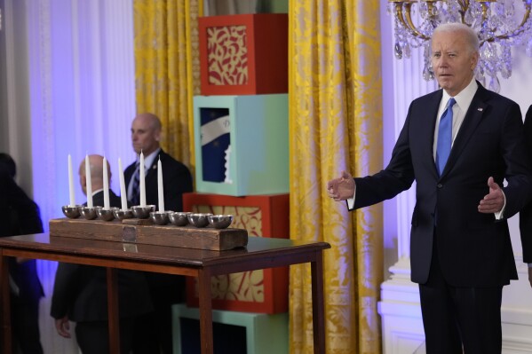President Joe Biden arrives to speak at a Hanukkah reception in the East Room of the White House in Washington, Monday, Dec. 11, 2023. (AP Photo/Jacquelyn Martin, Pool)
