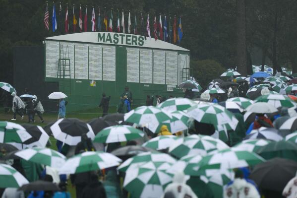 Masters Live Updates | Play to resume at 8:30 a.m. Sunday | AP News