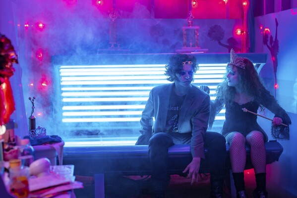 This image released by Focus Features shows Kathryn Newton, right, and Cole Sprouse in a scene from "Lisa Frankenstein." (Michele K. Short/Focus Features via AP)