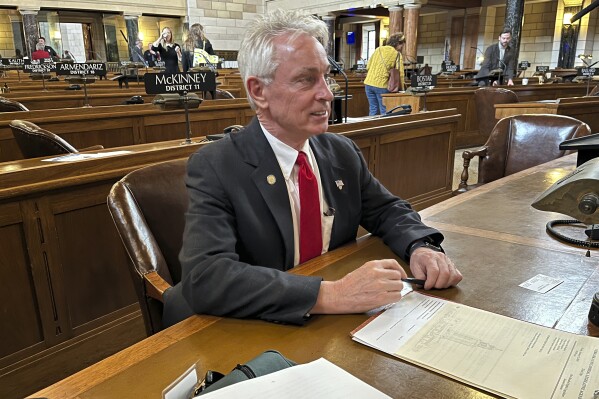 Nebraska state Sen. Loren Lippincott, of Central City, sits at his desk on the floor of the Nebraska State Capitol, Friday, Jan. 5, 2024 in Lincoln, Neb.. Lippincott has introduced a bill to add asphyxiation by nitrogen to the state's method of carrying out the death penalty. The measure comes even as Alabama officials await a judge's ruling on a request to block its plans to become the nation's first state to carry out an execution by nitrogen gas. (AP Photo/Margery Beck)