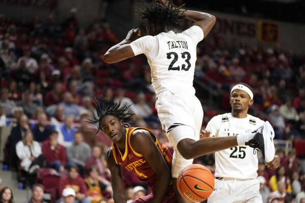 Iowa State guard Demarion Watson (4) passes around Lindenwood guard Jeremiah Talton (23) during the second half of an NCAA college basketball game, Thursday, Nov. 9, 2023, in Ames, Iowa. (AP Photo/Charlie Neibergall)