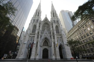 This Sunday, Aug. 30, 2015 file photo shows the newly renovated and cleaned facade of St. Patrick's Cathedral in New York. The Archdiocese of New York says at least 120 priests accused of sexually abusing a child or having child pornography have worked there over decades. The nation’s second-largest archdiocese released a list of names on Friday, April 26, 2019. (AP Photo/Mary Altaffer, File)