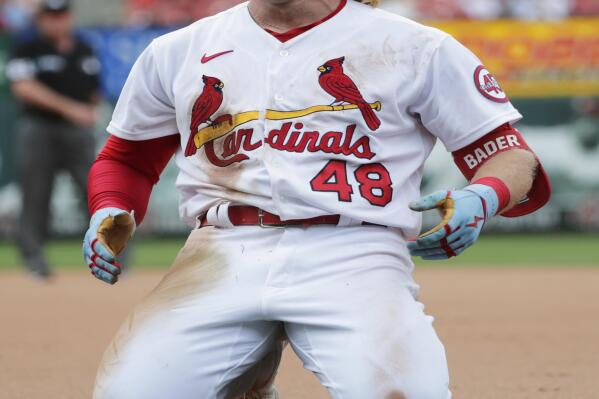 St. Louis Cardinals' Harrison Bader (48) celebrates after beating out an infield RBI-single in the seventh inning of a baseball game against the San Francisco Giants, Sunday, July 18, 2021, in St. Louis. (AP Photo/Tom Gannam)
