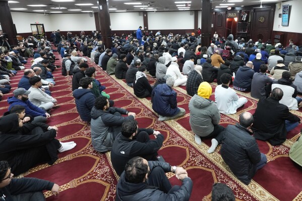 Imam Omar Suleiman speaks at the Islamic Center of Detroit in Detroit, Friday, Jan. 26, 2024. President Joe Biden's campaign manager has traveled to Michigan, where many Arab American leaders are enraged over the administration's policy toward Israel, and found some top activists unwilling to meet. (AP Photo/Paul Sancya)
