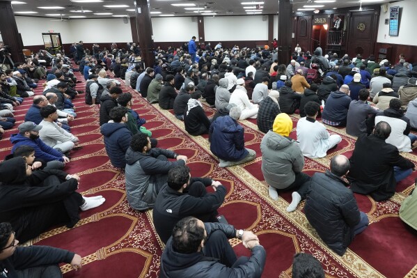 Imam Omar Suleiman speaks at the Islamic Center of Detroit in Detroit, Friday, Jan. 26, 2024. President Joe Biden's campaign manager has traveled to Michigan, where many Arab American leaders are enraged over the administration's policy toward Israel, and found some top activists unwilling to meet. (AP Photo/Paul Sancya)