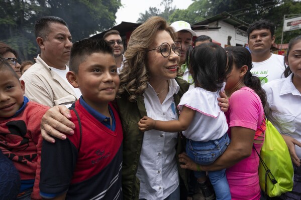 FILE - Former first lady Sandra Torres, National Unity of Hope presidential candidate, is greeted by supporters during a campaign rally in Amatitlan, Guatemala, May 14, 2023. Guatemalans go to the polls on June 25. (AP Photo/Moises Castillo, File)