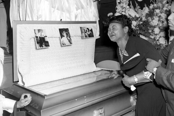 FILE - Mamie Till Mobley weeps at her son's funeral on Sept. 6, 1955, in Chicago. The mother of Emmett Till insisted that her son's body be displayed in an open casket forcing the nation to see the brutality directed at Blacks in the South at the time. Legislation that would make lynching a federal hate crime in the U.S. is expected to be signed into law by President Joe Biden. The Emmett Till Anti-Lynching Act was years in the making. (Chicago Sun-Times via AP, File)