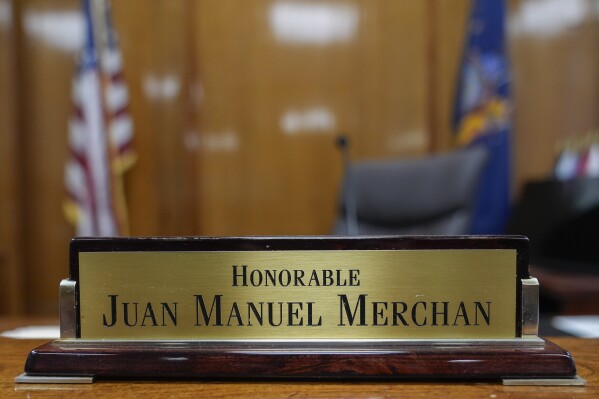 Judge Juan Merchan's name plate sits on the bench in his Manhattan criminal courtroom, Tuesday, March 12, 2024 in New York. A dozen Manhattan residents are soon to become the first Americans ever to sit in judgment of a former president charged with a crime. Jury selection is set to start Monday in former President Donald Trump's hush-money trial. (AP Photo/Seth Wenig)