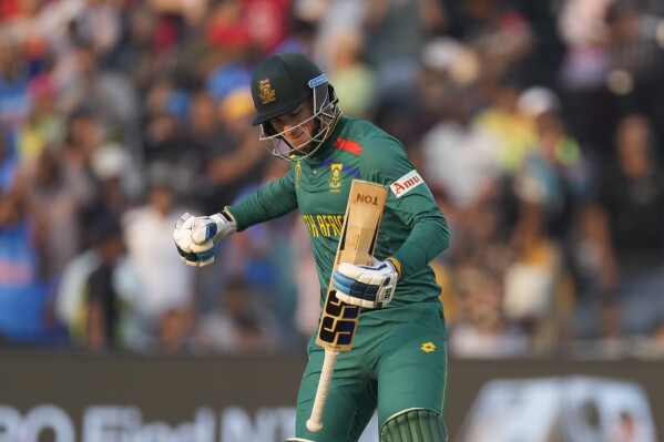 South Africa's Rassi Van Der Dussen celebrates his century during the ICC Men's Cricket World Cup match between New Zealand and South Africa in Pune, India, Wednesday, Nov.1, 2023. (AP Photo/Manish Swarup)