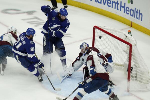 Tampa Bay Lightning left wing Pat Maroon (14) scores past Colorado Avalanche goaltender Darcy Kuemper (35) during the second period of Game 3 of the NHL hockey Stanley Cup Final on Monday, June 20, 2022, in Tampa, Fla. (AP Photo/Chris O'Meara)