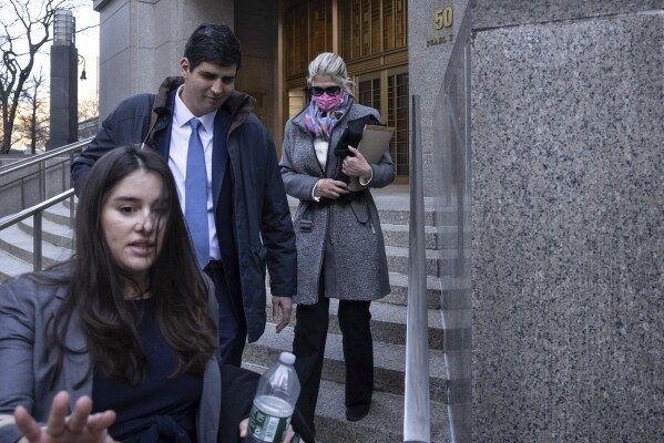 Nadine Menendez, back right, wife of former U.S. Sen. Bob Menendez, leaves Manhattan federal court, Tuesday, March 18, 2025, in New York. (AP Photo/Yuki Iwamura)