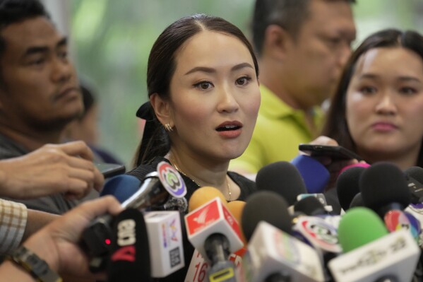 Paetongtarn Shinawatra, daughter of Thailand's former Prime Minister Thaksin Shinawatra, talks to reporters during a press conference at Pheu Thai Party headquarters in Bangkok, Thailand, Tuesday, Aug. 29, 2023. Former Thai Prime Minister Thaksin is stressed but in good spirits, his daughter Paetongtarn said, in the latest update on his health since he went into a Police general hospital last week. (AP Photo/Sakchai Lalit)