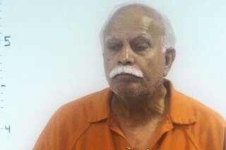 This undated photo provided by Western Tidewater Regional Jail shows Dr. Javaid Perwaiz.  Federal prosecutors have accused Perwaiz of performing unnecessary, unwanted or unknown gynecological procedures on some of his patients.  Perwaiz is due in U.S. District Court in Norfolk Thursday, Nov. 14, 2019 for a detention hearing. He was charged last week with health care fraud and making false statements relating to health care matters. (Western Tidewater Regional Jail via AP)
