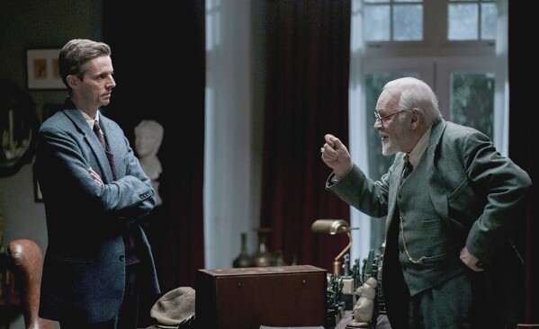 This image provided by Sony Pictures Classics shows Matthew Goode as C.S. Lewis and Anthony Hopkins as Sigmund Freud in a scene from "Freud's Last Session." (Sabrina Lantos/Sony Pictures Classics via AP)