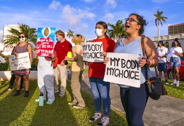 FILE - "My body, my choice!" resonates from protesters on the front lawn of the Guam Congress Building in Hagåtña during a protest as they voiced their concerns against the Guam Heartbeat Act of 2022 on April 27, 2022. Women from the remote U.S. territories of Guam and the Northern Mariana Islands will likely have to travel farther than other Americans to terminate a pregnancy if the Supreme Court overturns a precedent that established a national right to abortion in the United States. (Rick Cruz/The Pacific Daily via AP, File)