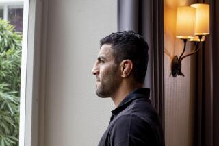 FILE - In this photo taken Sept. 12, 2019 file photo, Iranian judoka Saeid Mollaei poses for a portrait photo at an undisclosed southern city of Germany. Iran’s suspension from international judo events for refusing to let its athletes fight Israeli opponents has been overturned by the Court of Arbitration for Sport, it was reported on Monday, March 1, 2021. The case was provoked by former world champion Saeid Mollaei leaving the Iranian team in 2019. He claimed he was ordered by team officials to lose matches and withdraw from competitions to avoid facing Israelis. (AP Photo/Michael Probst, FIle)