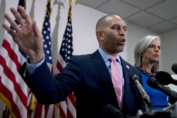 
              Democratic Caucus Chairman Rep. Hakeem Jeffries of N.Y., accompanied by Democratic Caucus Vice Chair Katherine Clark, D-Mass., right, speaks at a news conference following a House Democratic Caucus meeting on Capitol Hill in Washington, Wednesday, Jan. 23, 2019. (AP Photo/Andrew Harnik)
            