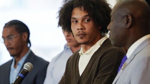 Standing with other former Northwestern athletes, former Northwestern football player Simba Short speaks during a press conference addressing widespread hazing accusations at Northwestern University Wednesday, July 19, 2023, in Chicago. (AP Photo/Erin Hooley)