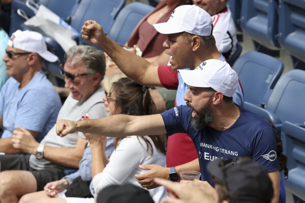 Tennis fans cheer during a match between Sloane Stephens, of the United States, and Beatriz Haddad Maia, of Brazil, during the first round of the U.S. Open tennis championships, Monday, Aug. 28, 2023, in New York. (AP Photo/Jason DeCrow)
