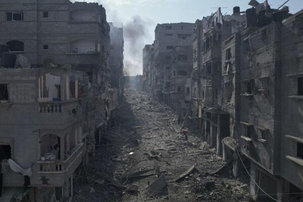 FILE - A view of the rubble of buildings hit by an Israeli airstrike, in Jabalia, Gaza strip, on Oct. 11, 2023. After 11 weeks of war in Gaza, the Israeli military campaign against Hamas now sits among the deadliest and most destructive in history. The Palestinian death toll is approaching 20,000 and satellite data shows that one-third of structures across the tiny enclave have been destroyed. (AP Photo/Hatem Moussa, File)