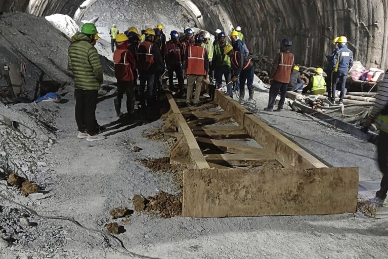 This photo provided by Uttarakhand State Disaster Response Force (SDRF) shows rescue work inside a collapsed road tunnel where 40 workers were trapped in northern in Uttarakhand state, India, Tuesday, Nov.14, 2023. ( SDRF via AP)