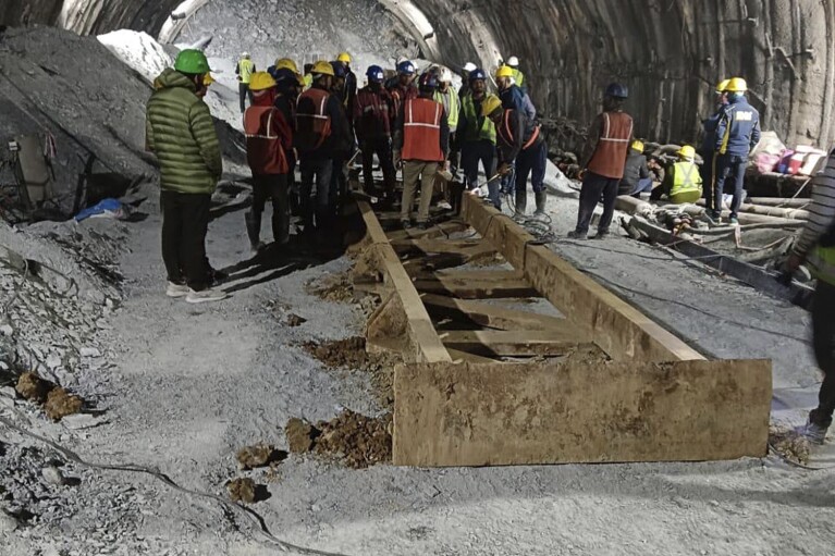 This photo provided by Uttarakhand State Disaster Response Force (SDRF) shows rescue work inside a collapsed road tunnel where 40 workers were trapped in northern in Uttarakhand state, India, Tuesday, Nov.14, 2023. ( SDRF via AP)