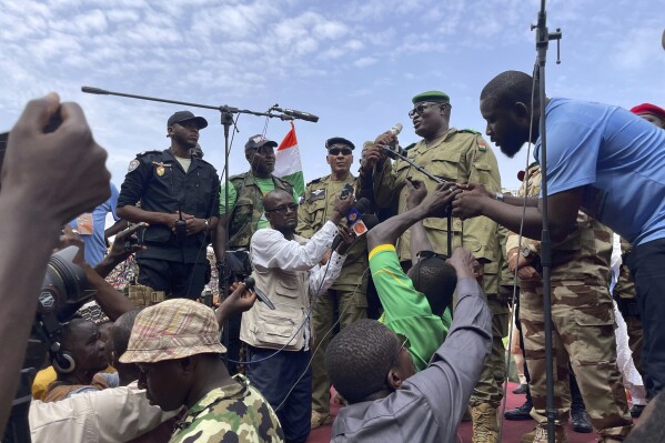 FILE - Mohamed Toumba, one of the soldiers who ousted Nigerian President Mohamed Bazoum, addresses supporters of Niger's ruling junta in Niamey, Niger, Sunday, Aug. 6, 2023. The U.S. is making precautionary plans to evacuate two key drone and counter-terror bases in Niger if that becomes necessary under the West African nation’s new ruling junta. That word came Friday, Aug. 18, from the Air Force commander for Africa, Gen. James Hecker. The Air Force general stressed to reporters in Washington that there had been no U.S. decision to evacuate Niger, which has been the United States' top counter-terror outpost in West Africa's Sahara and Sahel regions. (AP Photo/Sam Mednick, File)